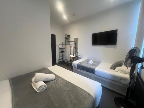 Habitación Triple Deluxe del hotel Oyo Amsterdam. Foto 34