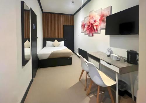 Habitación cuádruple del hotel Oyo Amsterdam. Foto 21