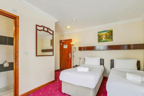 Habitación Triple del hotel London Star. Foto 3