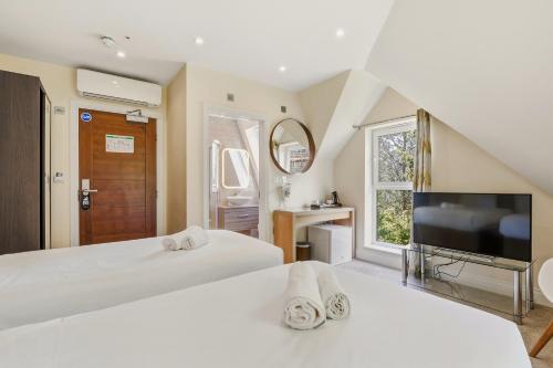 Habitación Doble Deluxe - 2 camas del hotel London Star. Foto 3