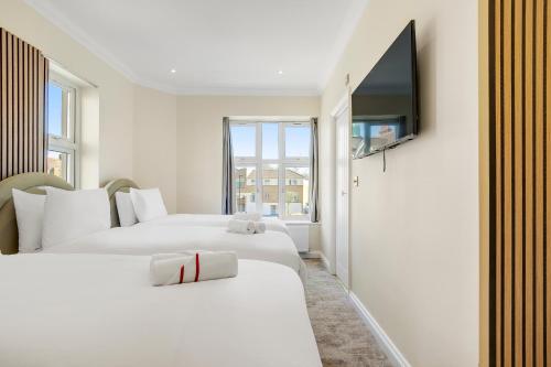 Habitación Triple de lujo del hotel London Star. Foto 3