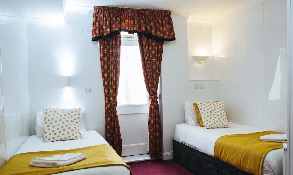 Habitación con 2 camas individuales del hotel Lord Kensington