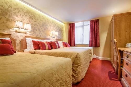 Habitación Cuádruple Clásica del hotel Montana London. Foto 1