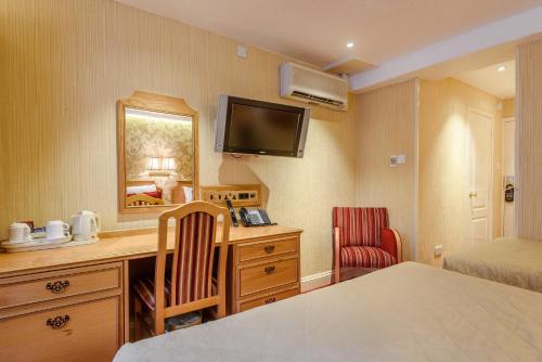 Habitación Cuádruple Clásica del hotel Montana London. Foto 2