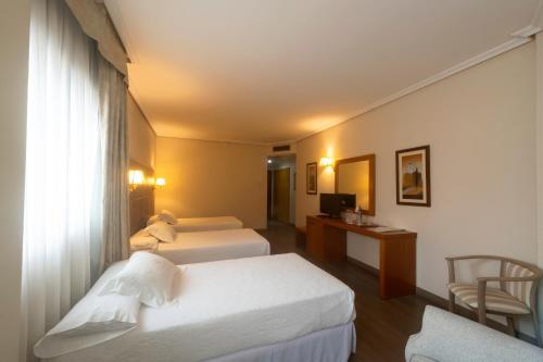 Habitación Doble con cama supletoria del hotel Galicia Palace. Foto 2