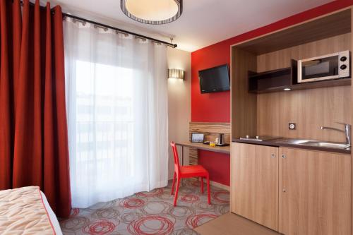 Estudio con cama doble del hotel Aparthotel Adagio Lyon Patio Confluence. Foto 8