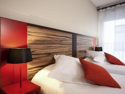 Estudio con 2 camas individuales del hotel Aparthotel Adagio Lyon Patio Confluence. Foto 1