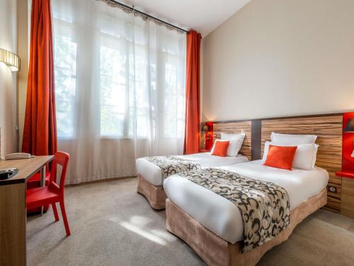 Estudio con 2 camas individuales del hotel Aparthotel Adagio Lyon Patio Confluence. Foto 5