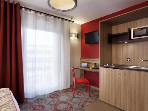 Estudio con cama doble del hotel Aparthotel Adagio Lyon Patio Confluence. Foto 4