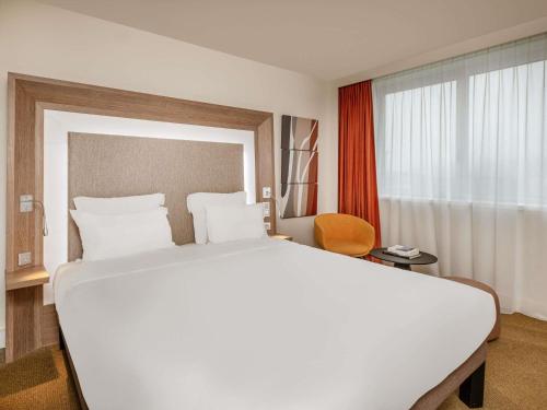 Habitación Doble Clásica del hotel Novotel Lyon Confluence. Foto 1
