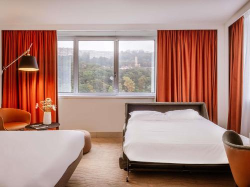Habitación Doble Executive con sofá cama del hotel Novotel Lyon Confluence. Foto 6