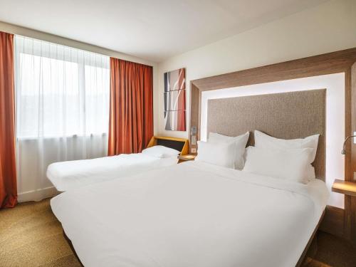 Executive Double Room with Sofa and River View del hotel Novotel Lyon Confluence. Foto 1