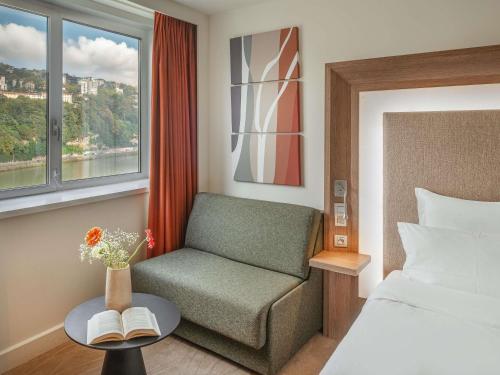 Executive Double Room with Sofa and River View del hotel Novotel Lyon Confluence. Foto 2