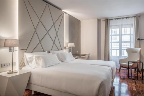 Habitación Doble Superior - 2 camas del hotel NH Salamanca Palacio de Castellanos. Foto 2