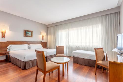 Habitación Doble con cama supletoria - 1 o 2 camas del hotel Regio. Foto 1