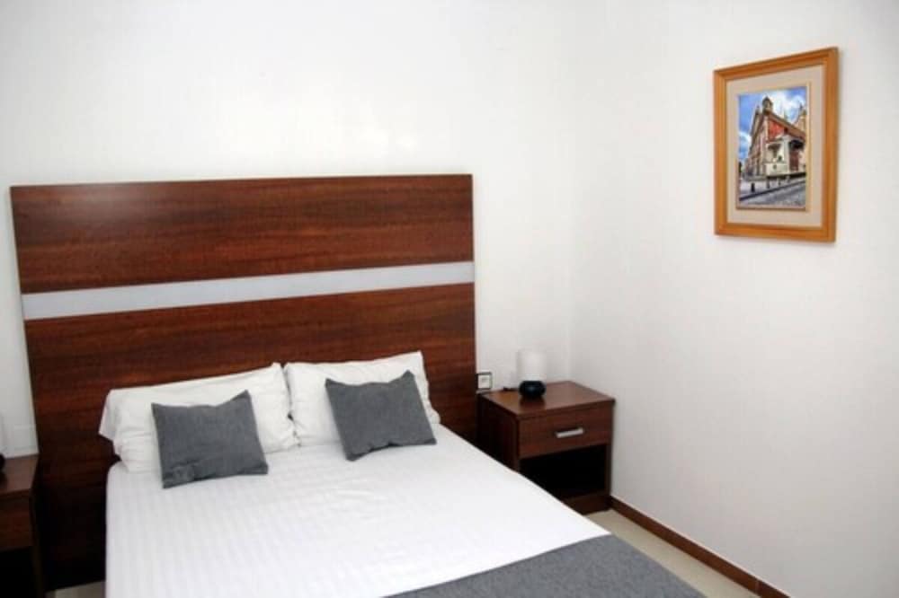 Habitación junior (Suit) del hotel Hospedium Blu Torre de Sevilla,