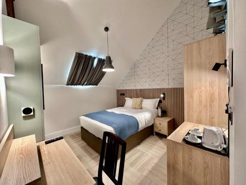Habitación Individual con cama grande del hotel The Pillar