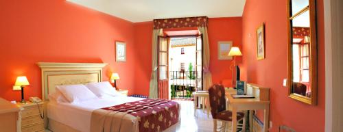Habitación Deluxe del hotel Alcázar De La Reina. Foto 1