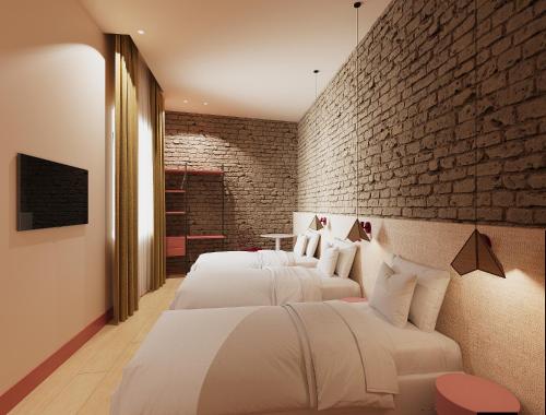 Habitación Triple del hotel BYPILLOW Naranjo. Foto 2