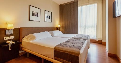 Habitación Triple del hotel Vertice Sevilla. Foto 1