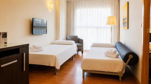 Habitación Cuádruple del hotel Vertice Sevilla. Foto 5
