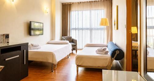 Habitación Cuádruple del hotel Vertice Sevilla. Foto 6