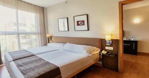 Junior suite Con Vistas 2 Camas individuales del hotel Vertice Sevilla. Foto 5