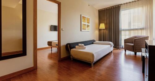 Habitación familiar Con Vistas del hotel Vertice Sevilla. Foto 7