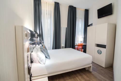 Habitación Doble del hotel Petit Palace Canalejas. Foto 1