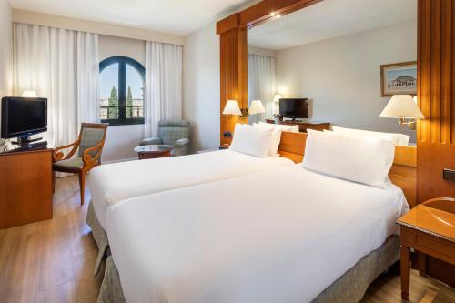 Habitación Doble con vistas a la ciudad - 1 o 2 camas del hotel Exe Sevilla Macarena. Foto 1