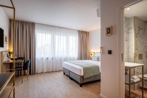 Habitación Doble Deluxe del hotel Jill Brussels. Foto 1