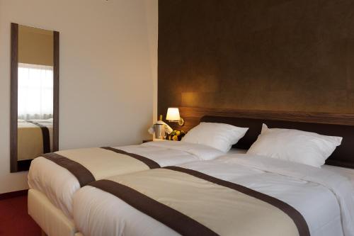 Habitación Doble Confort - 2 camas del hotel Golden Tulip De' Medici. Foto 1
