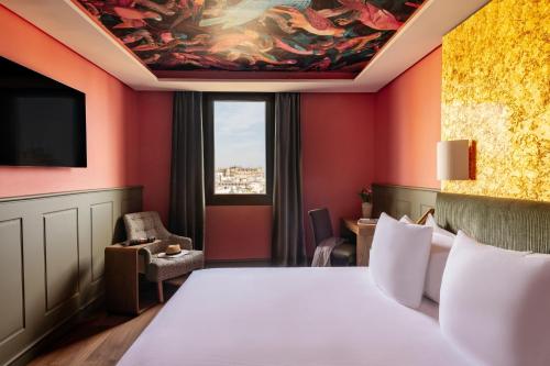 Habitación Red Level con vistas a la ciudad y a la catedral del hotel Colón Gran Meliá. Foto 39