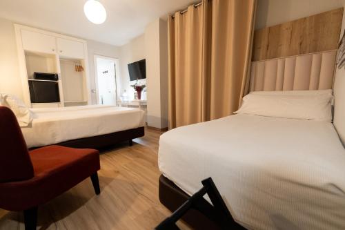 Habitación Doble con Cama supletoria del hotel Sercotel Doña Carmela. Foto 8