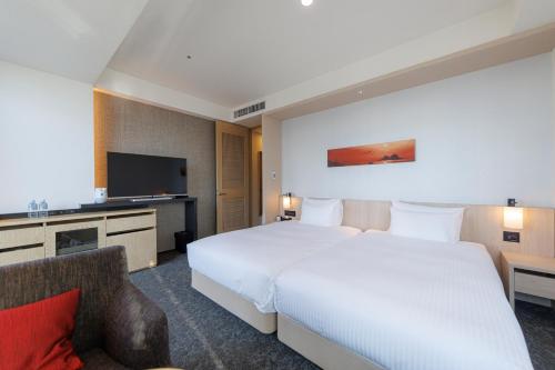 Habitación Premium con 2 camas individuales y vistas desde el baño (plantas 15 y 16) - No fumadores del hotel Jr Kyushu Blossom Shinjuku. Foto 3