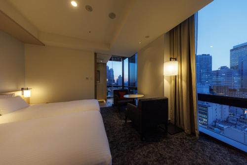 Habitación Premium con 2 camas individuales y vistas desde el baño (plantas 15 y 16) - No fumadores del hotel Jr Kyushu Blossom Shinjuku. Foto 11