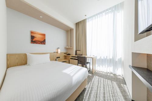 Habitación Doble Estándar - No fumadores del hotel Jr Kyushu Blossom Shinjuku. Foto 1