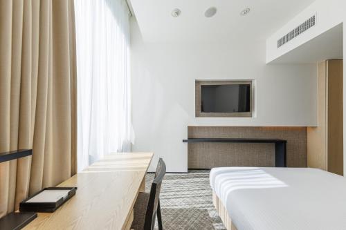 Habitación Doble Estándar - No fumadores del hotel Jr Kyushu Blossom Shinjuku. Foto 3