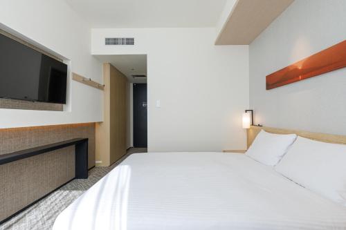 Habitación Doble Estándar con cama grande - No fumadores del hotel Jr Kyushu Blossom Shinjuku. Foto 1