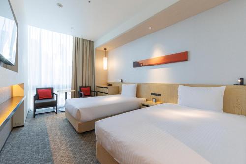 Habitación Doble Superior para no fumadores - 2 camas del hotel Jr Kyushu Blossom Shinjuku. Foto 1