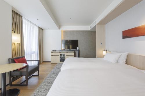 Habitación Doble Deluxe Hollywood (3 personas) - 2 camas - No fumadores del hotel Jr Kyushu Blossom Shinjuku. Foto 9