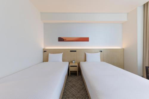 Habitación Doble Deluxe - 2 camas del hotel Jr Kyushu Blossom Shinjuku. Foto 4