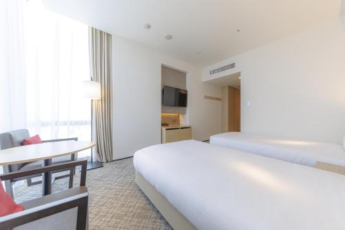 Habitación Doble Deluxe - 2 camas del hotel Jr Kyushu Blossom Shinjuku. Foto 7