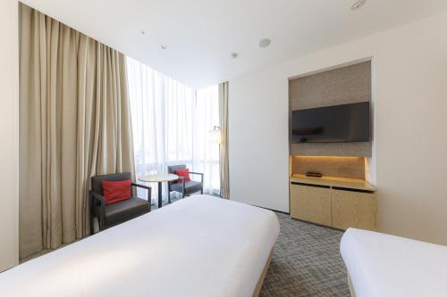Habitación Doble Deluxe - 2 camas del hotel Jr Kyushu Blossom Shinjuku. Foto 9