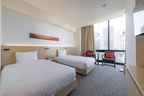 Habitación Doble Deluxe (3 personas) - 2 camas del hotel Jr Kyushu Blossom Shinjuku. Foto 1