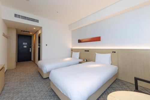 Habitación Doble Deluxe (3 personas) - 2 camas del hotel Jr Kyushu Blossom Shinjuku. Foto 5