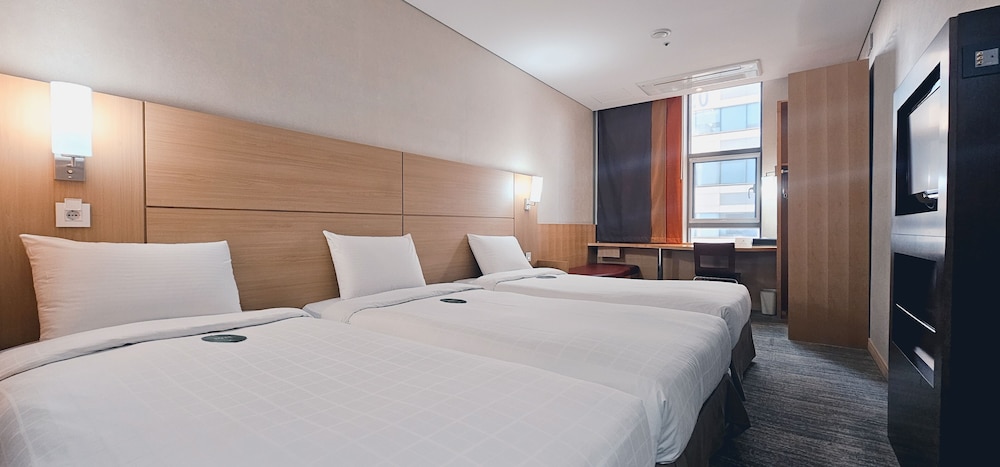 Habitación Triple Estándar del hotel Central Seven Hotel by Kwon Busan Seomyeon. Foto 1