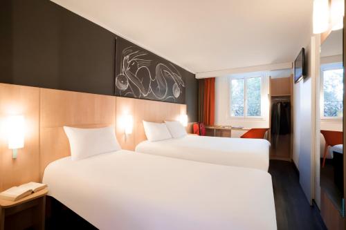 Habitación Estándar - 1 cama doble y 1 individual del hotel Ibis Maine Montparnasse. Foto 4