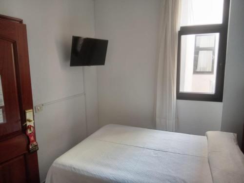 Habitación individual Vista Patio Económica 1 Cama Individual del hotel Tropical. Foto 10