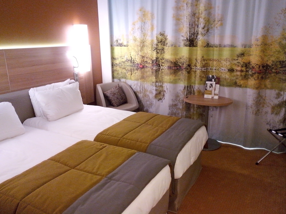 Habitación Classic con dos camas individuales del hotel Mercure Macon Bord De Saône. Foto 2